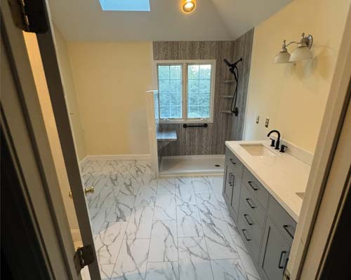 Red brick home with light shingled roof