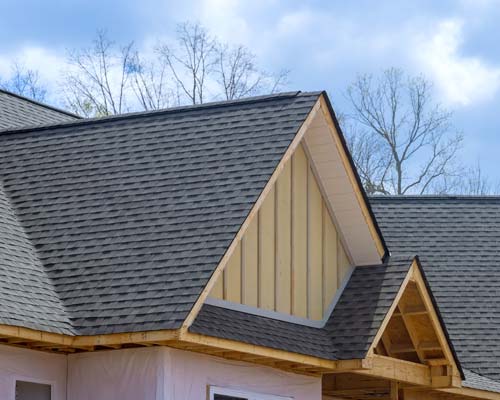 Storm damaged shingle with circled damage marks